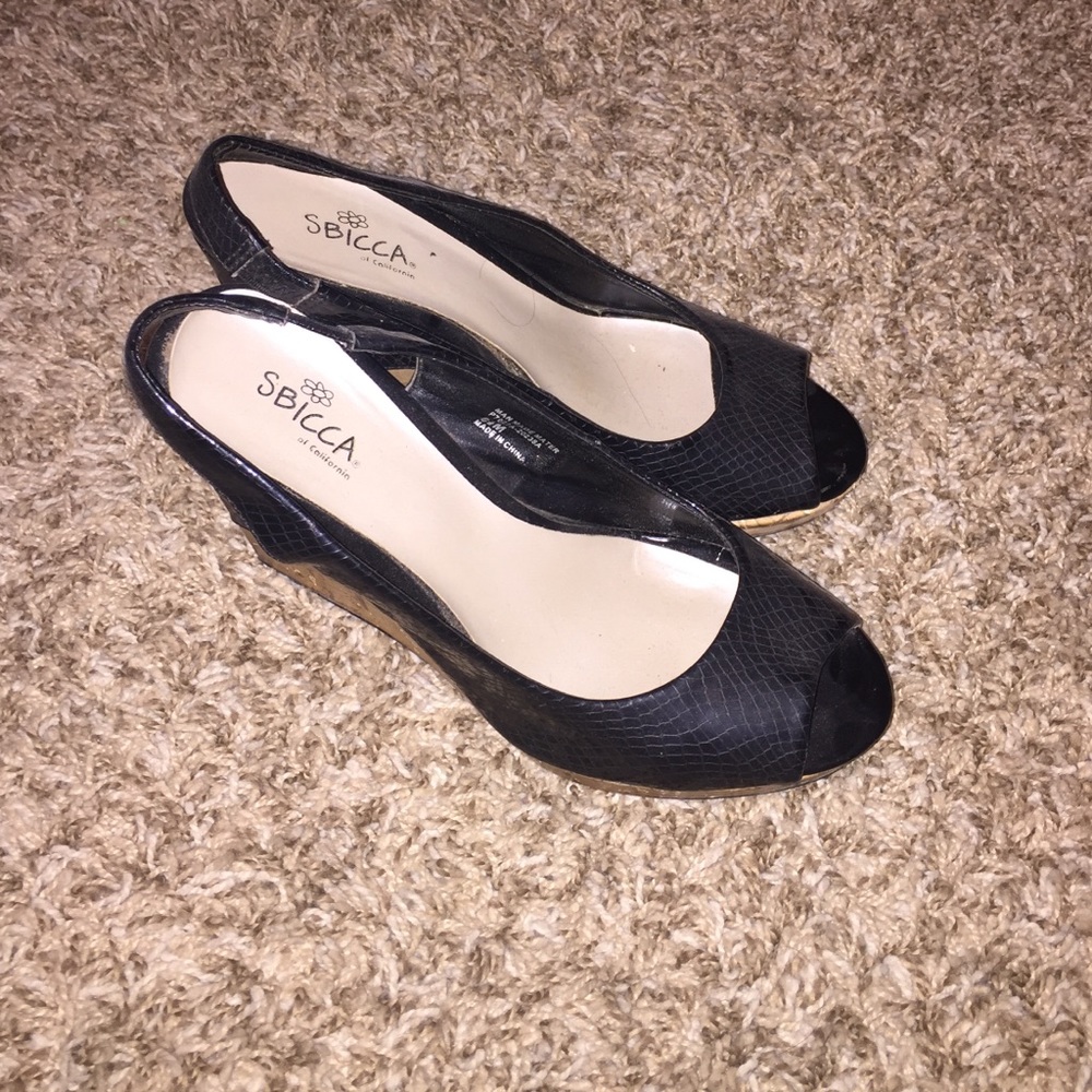 Black wedges with Cork heel.